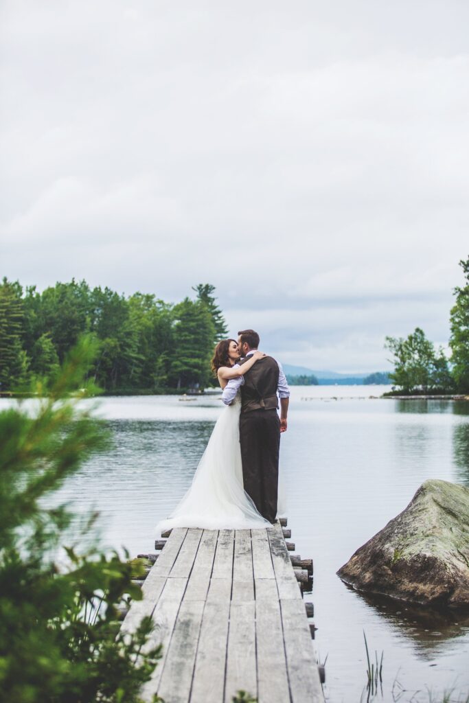 Bride and Groom kissing on the dock