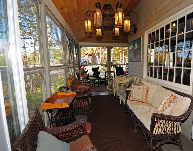 Big Moose Inn - Screened Porch with seating for relaxing